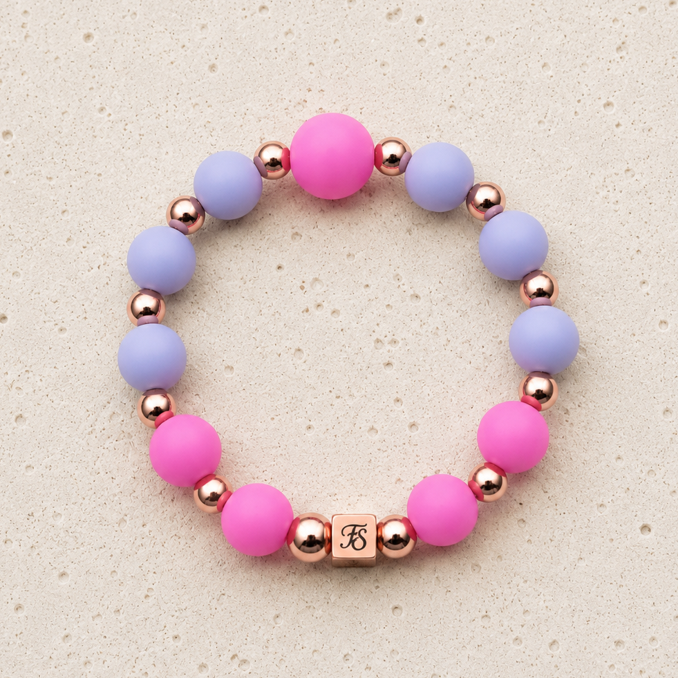 Rosy Glow pink and lilac silicone bracelet with rose gold hematite beads, handcrafted by Fleur & Stone in Kerry, Ireland.
