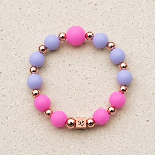 Rosy Glow pink and lilac silicone bracelet with rose gold hematite beads, handcrafted by Fleur & Stone in Kerry, Ireland.