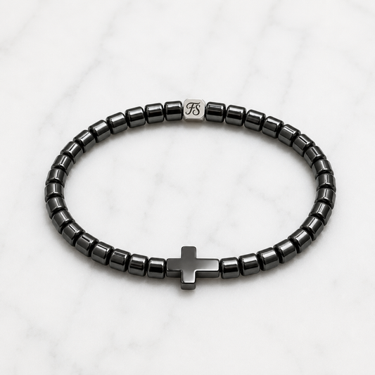4mm Natural Hematite Cross bracelet with polished Hematite beads and stainless steel Fleur & Stone logo spacer.