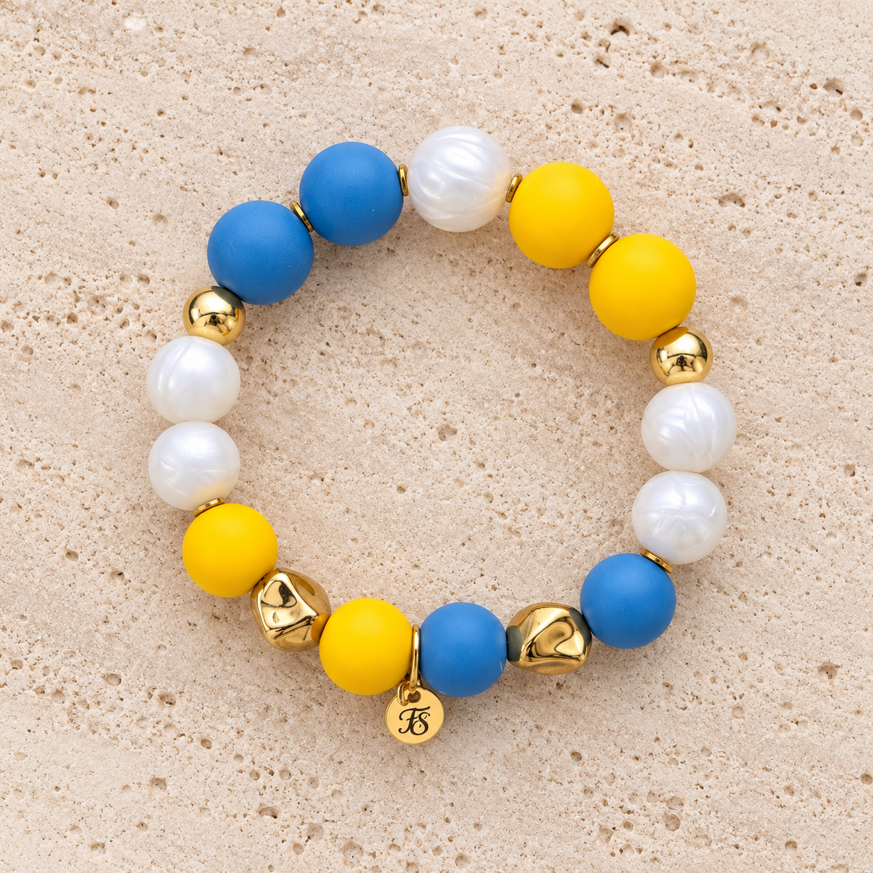 Kerry Coast blue yellow and pearly white silicone bead bracelet with gold hematite accents by Fleur & Stone