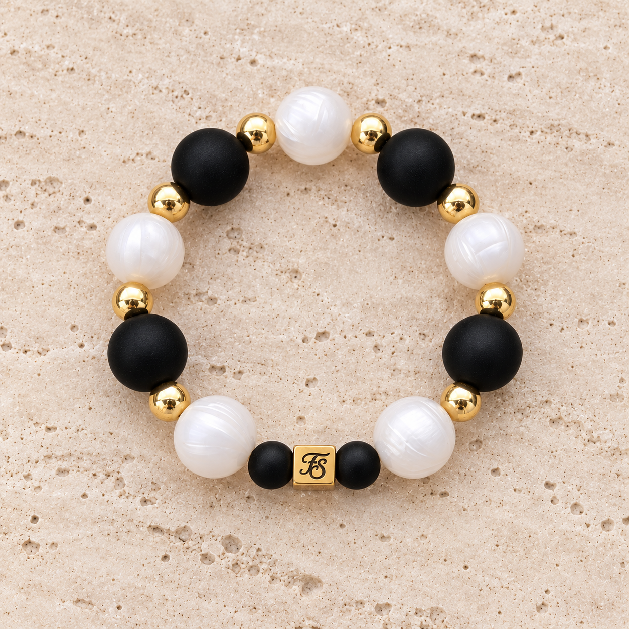 Midnight Pearl black and pearly white silicone bead bracelet with gold hematite accents by Fleur & Stone