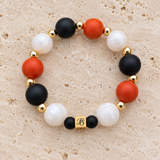 Ember Moon black terracotta and pearly white silicone bead bracelet with gold hematite accents by Fleur & Stone