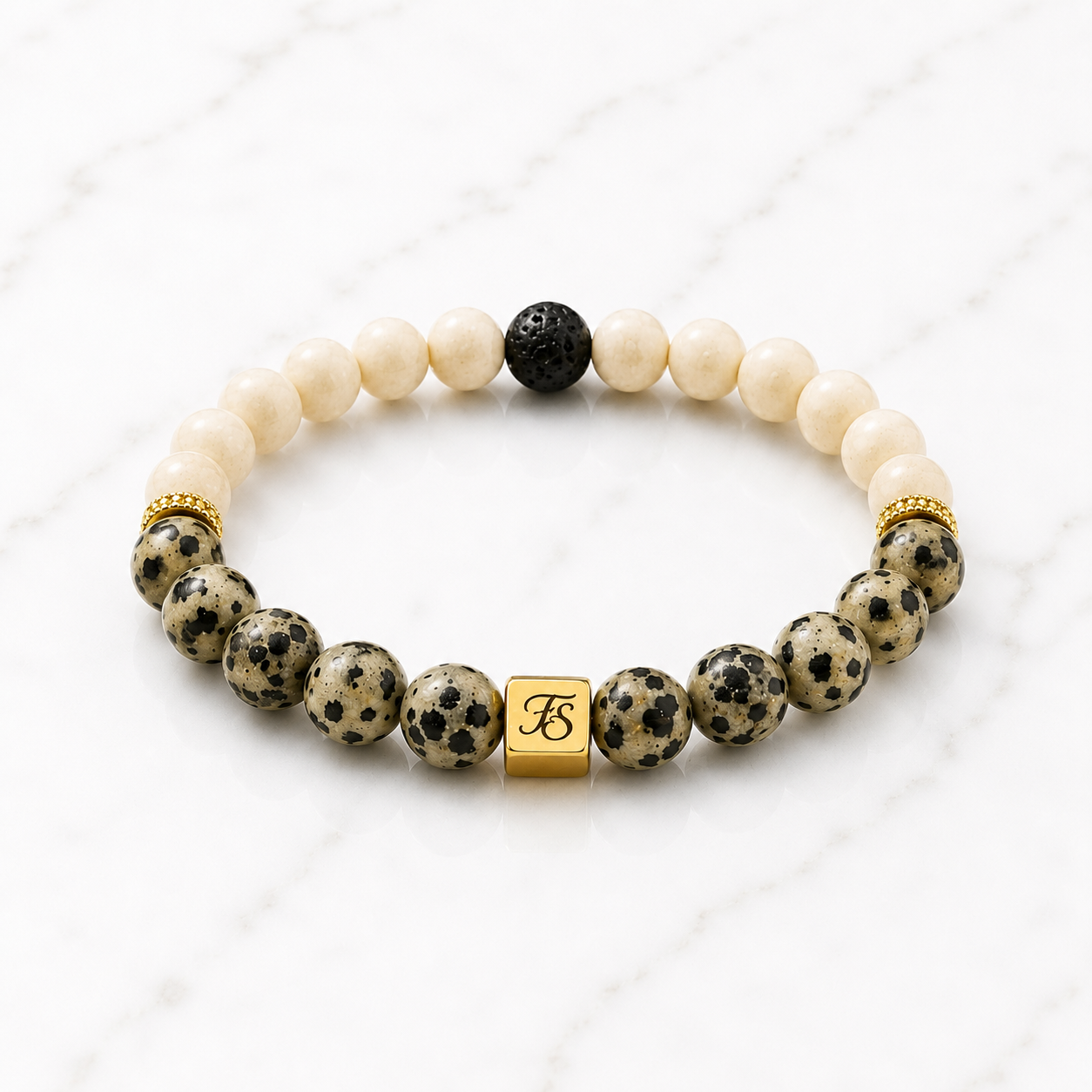 Frosted Fossil and Dalmatian Jasper gemstone bracelet with lava stone, gold plated rhinestone spacers and Fleur & Stone logo bead.